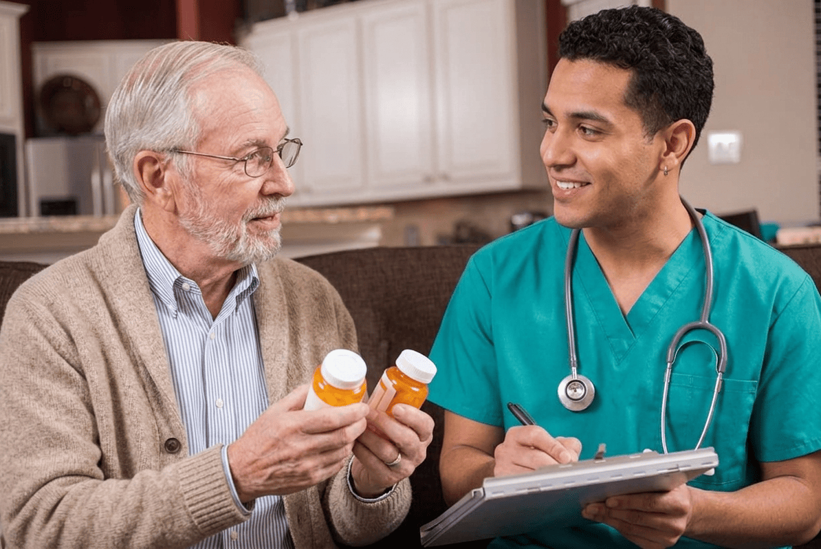 Male nurse providing principal Care Management support for a complex condition patient at a Long Island medical practice