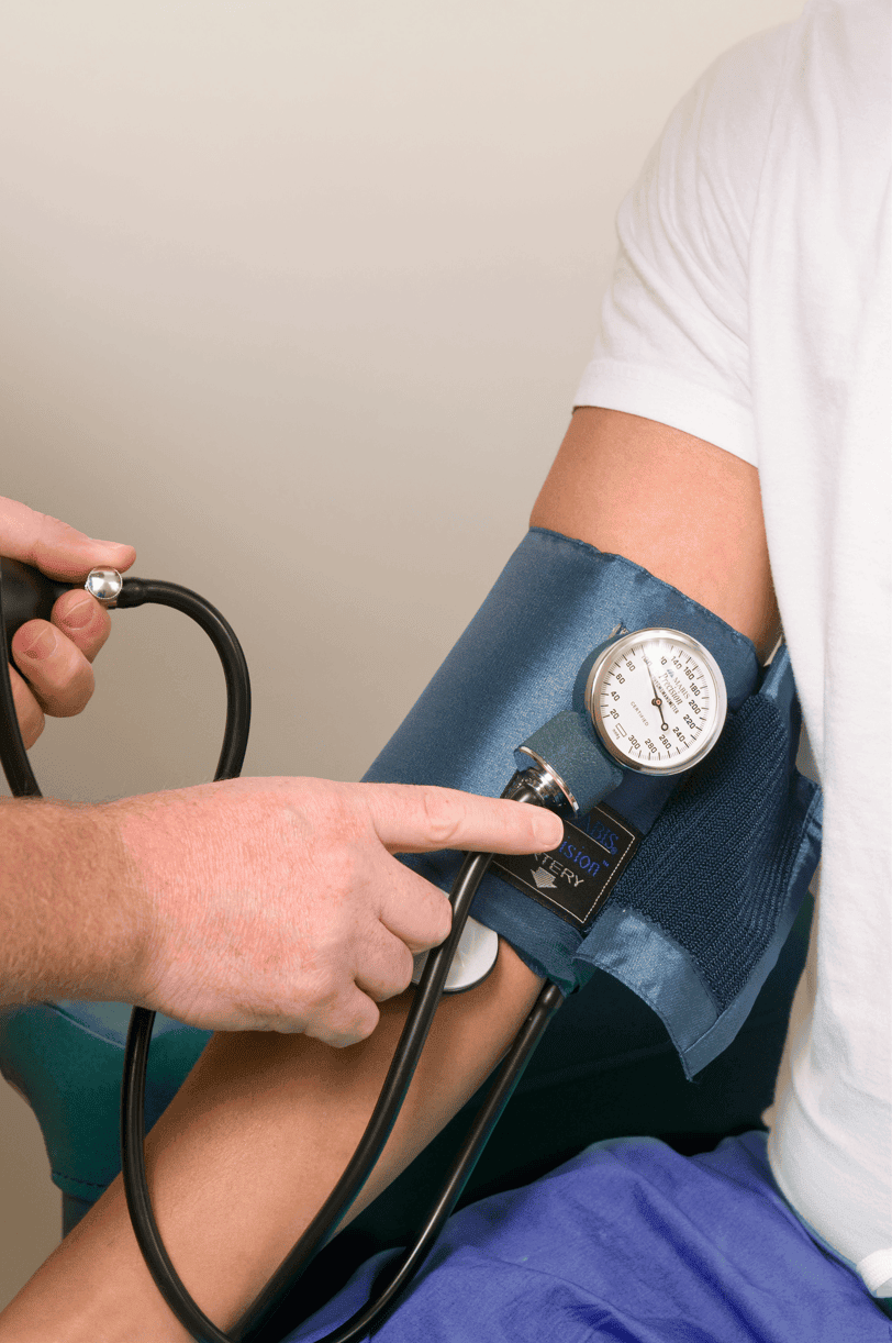 Patient having blood pressure taken as part of remote patient monitoring program managed by TCT Consultants